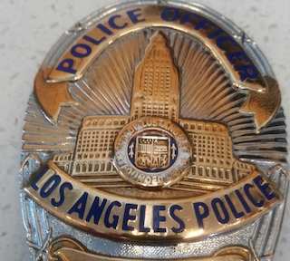 domestic_viol_summ_64_-_lapd_badge.jpg